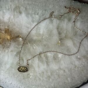Gold Necklace with Intricate Pendant Design